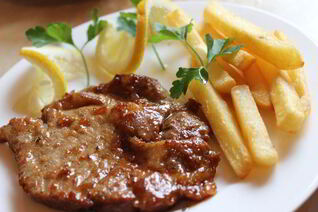 Свиной стейк в апельсиновом маринаде