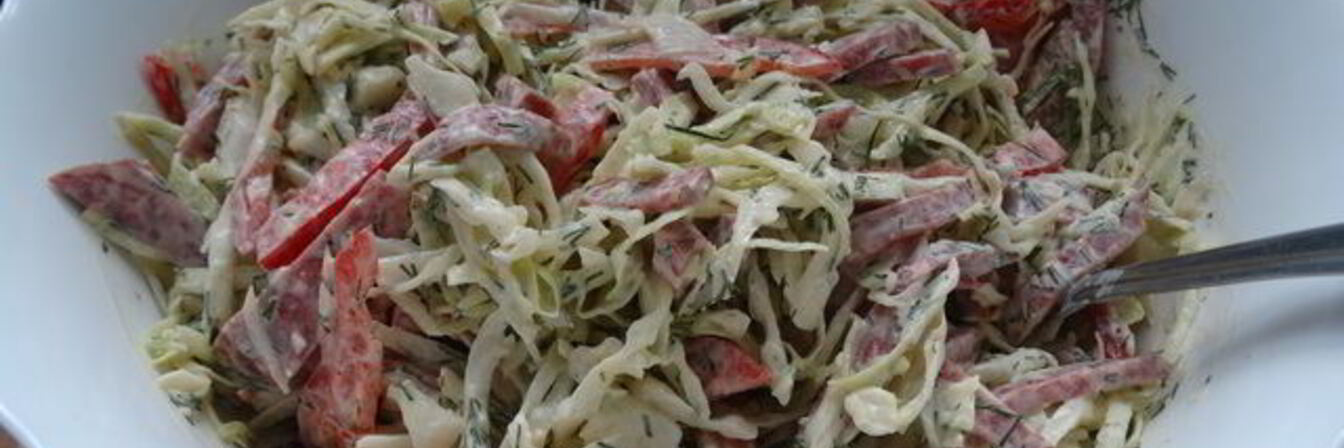 Салат из молодой капусты с колбасой